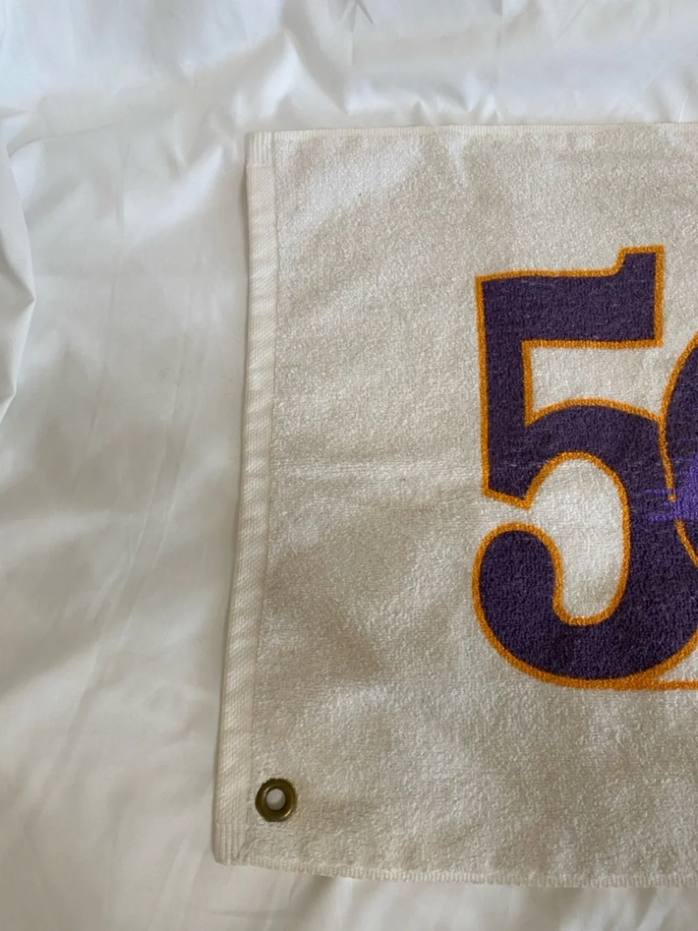 Los Angeles Lakers 50th anniversary towel with team's commemorative logo.